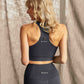 Woman wearing Hachure Fern Crop Top recycled polyester back view