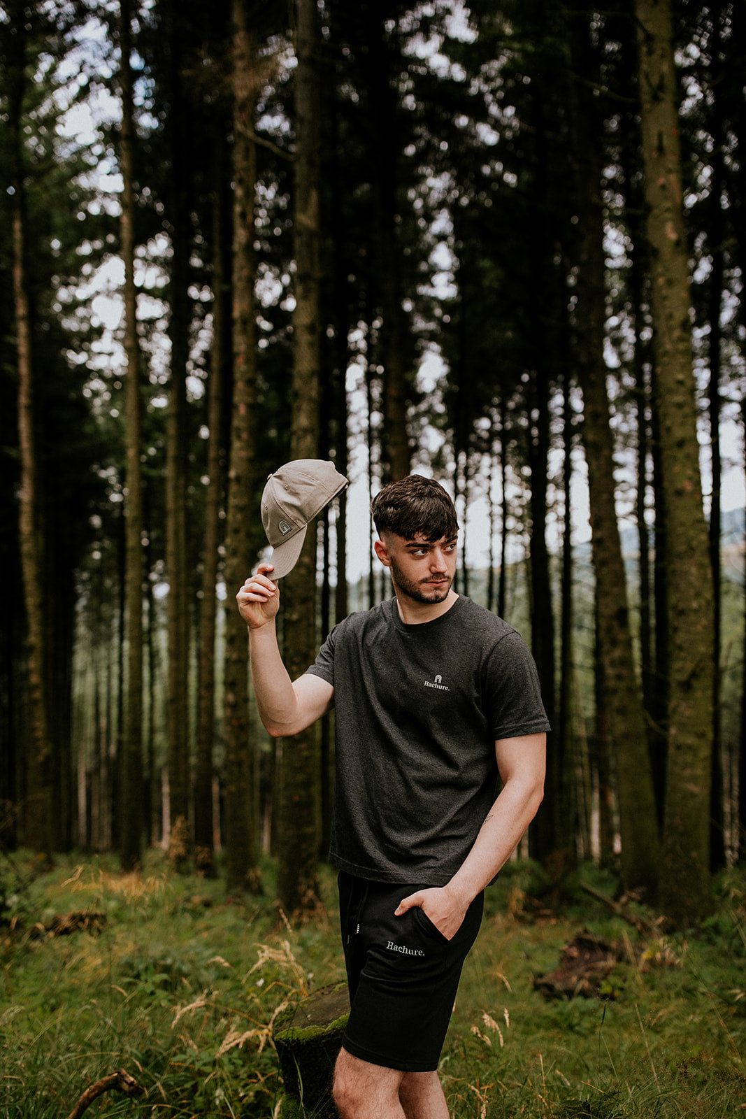 Man wearing grey hemisphere t-shirt in the forest 
