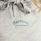Close up of Hachure grey Wilder Hoodie logo embroidery 